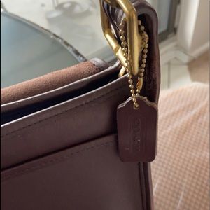 Coach shoulder bag with zipper and pockets